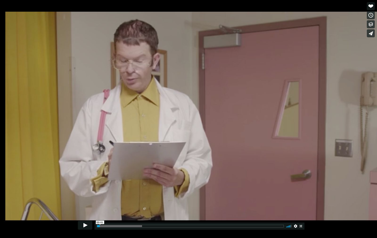 a man in a lab coat holding a tablet