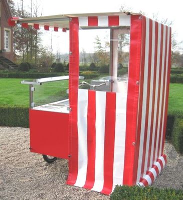 a red and white striped ice cream cart