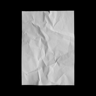 a piece of white paper with a black background