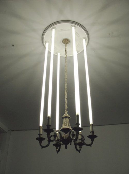 a chandelier with five lights hanging from it