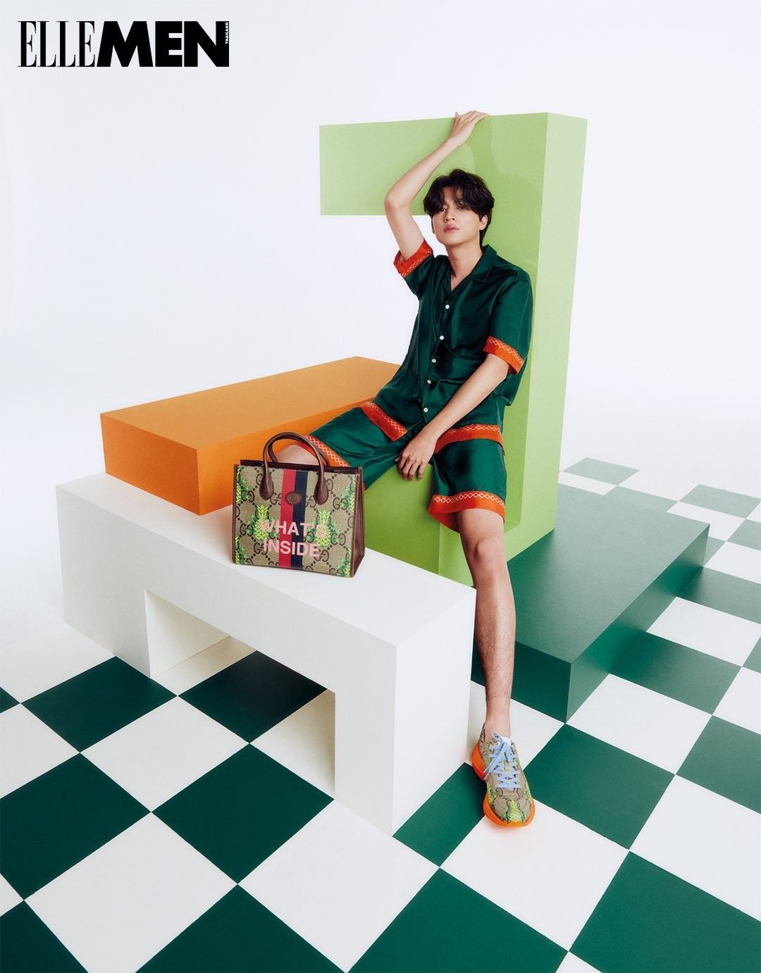 a woman sitting on a bench with a handbag