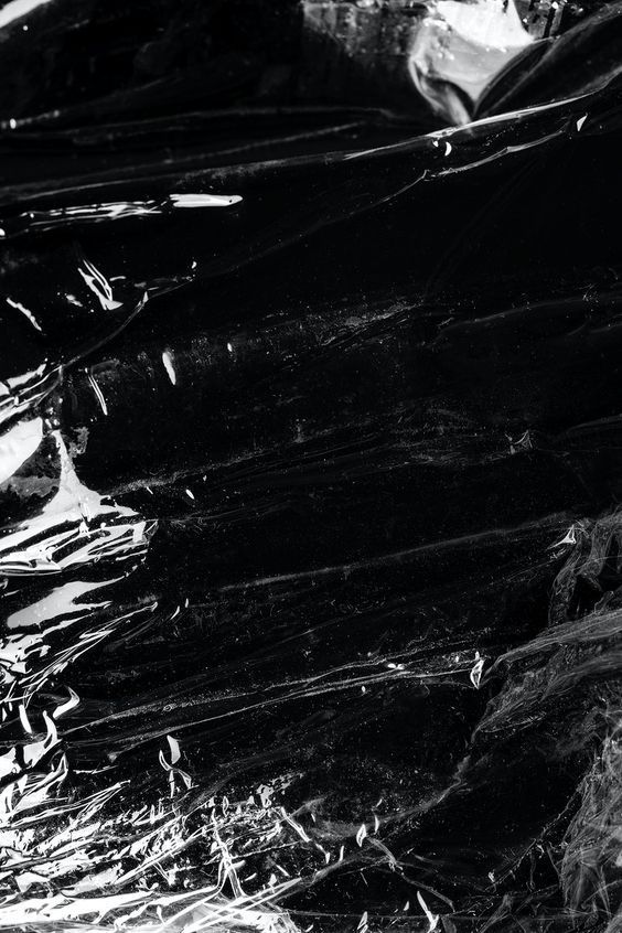 a black and white photo of foil wrapped in plastic