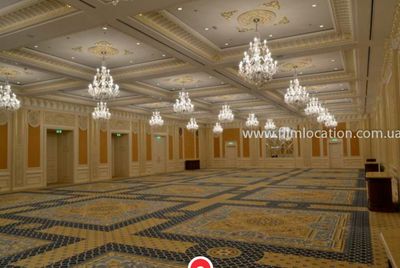 a large ballroom with chandeliers and chandeliers