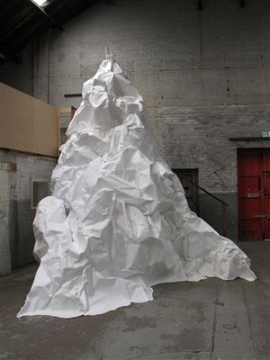 a large white piece of paper sitting in a room