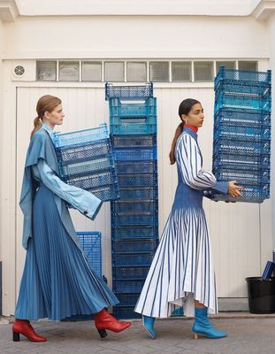 a couple of women walking down a street