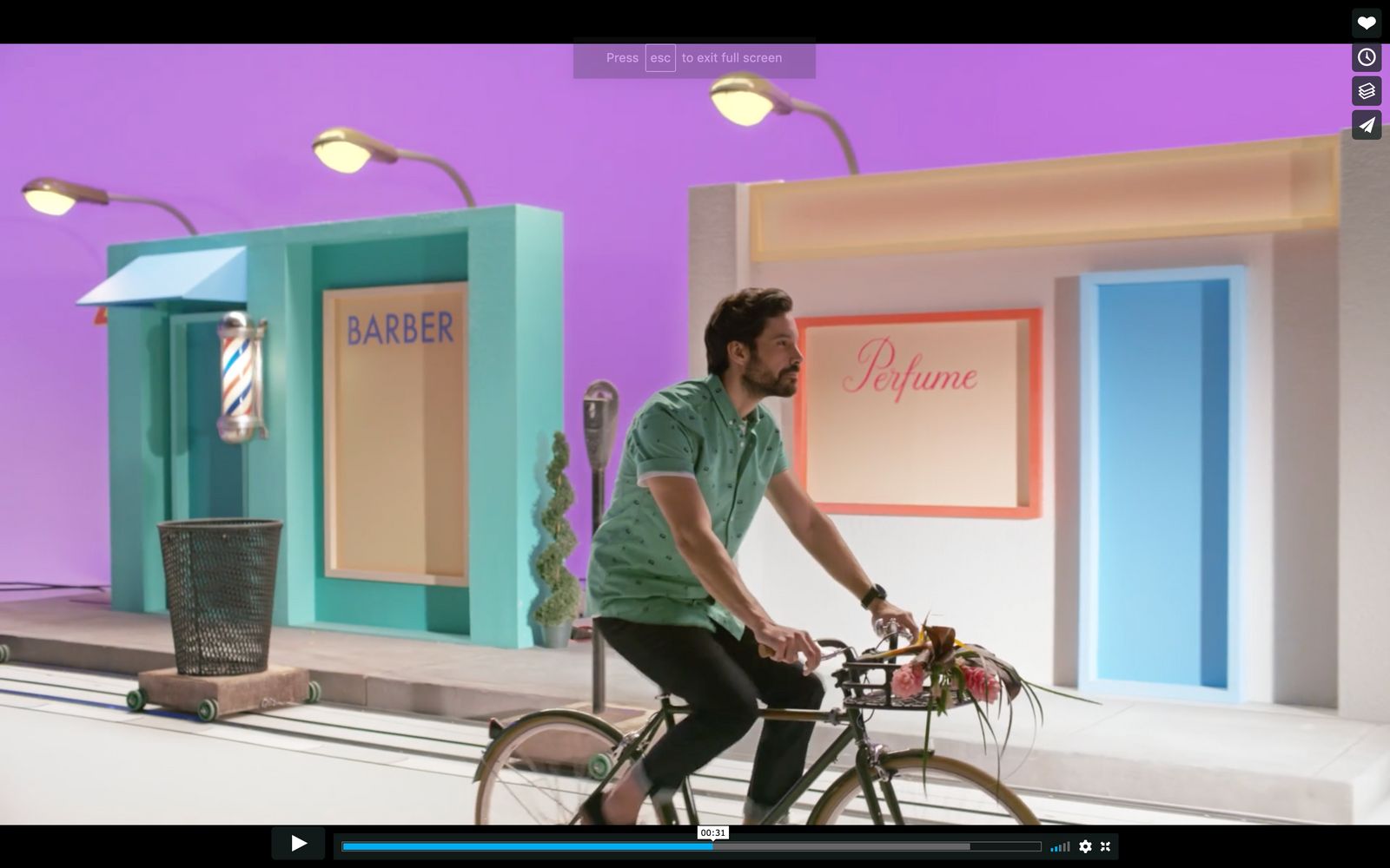 a man riding a bike in front of a store