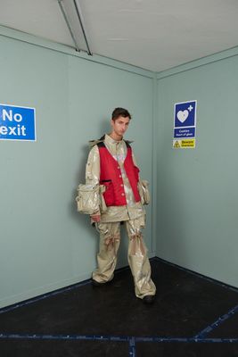 a man standing in a room with no exit signs