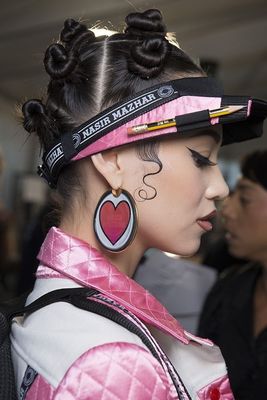 a woman with a heart tattoo on her head