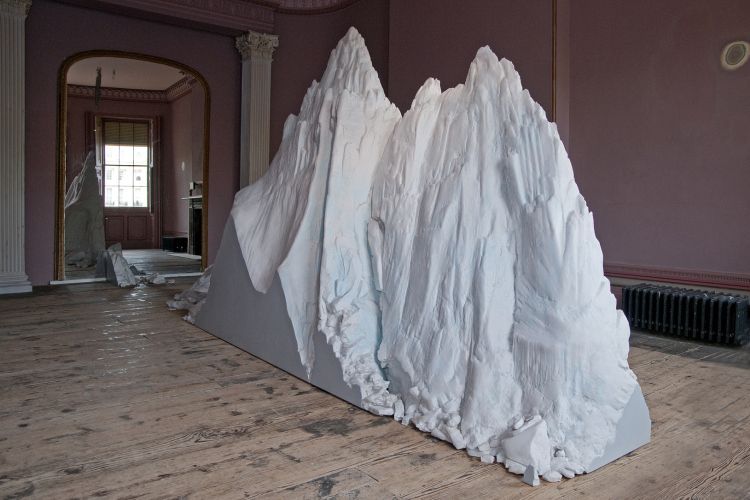 a large piece of paper sitting on top of a wooden floor