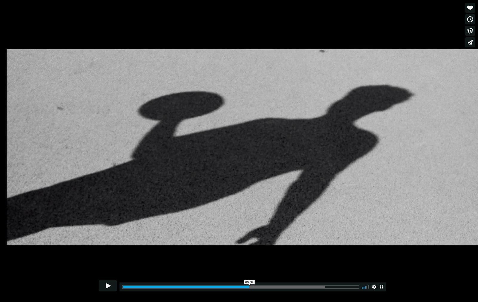 a shadow of a person holding a frisbee