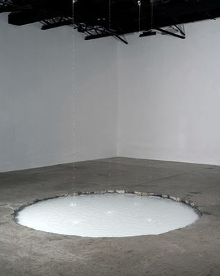 a manhole in the floor of a white room