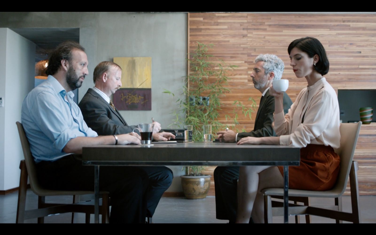 a group of people sitting around a table