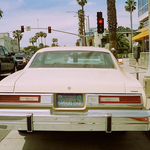 a white car parked on the side of the road