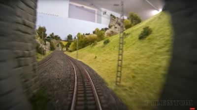 a blurry photo of a train track going through a tunnel