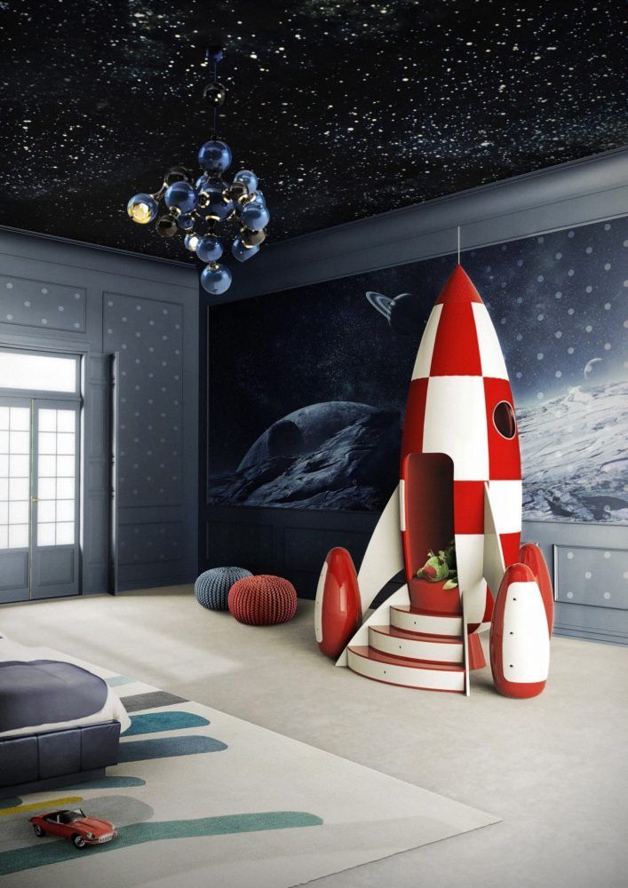 a child's room with a rocket ship mural