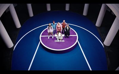 a group of people standing on top of a basketball court