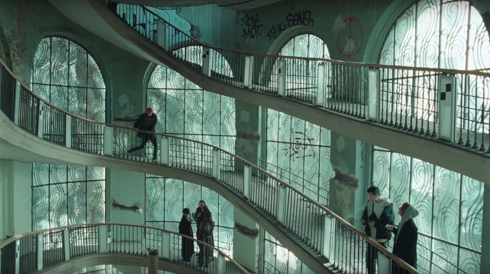 a group of people walking up and down a set of stairs