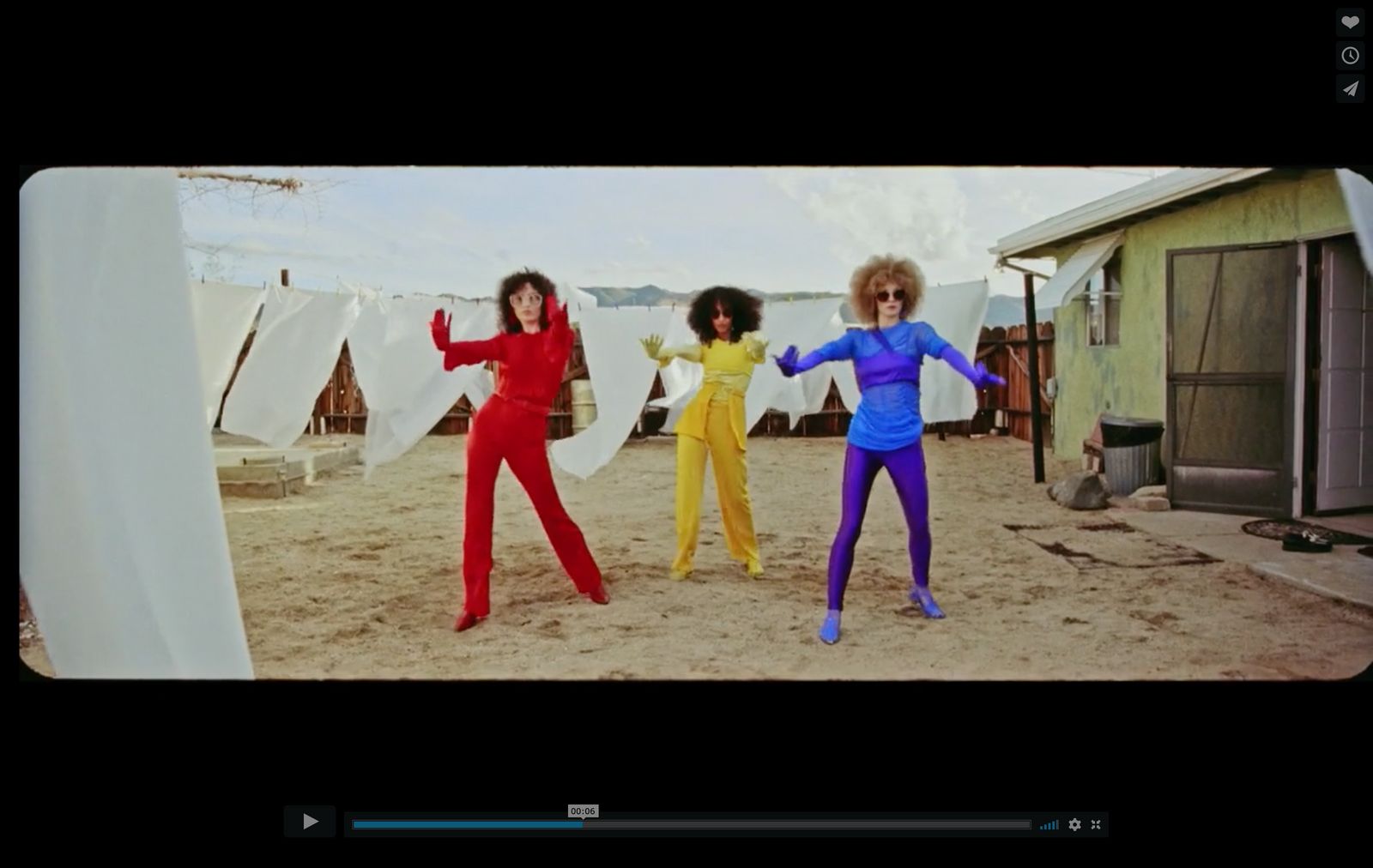 a group of three women standing next to each other