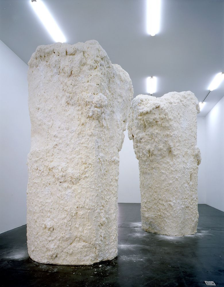 a couple of large white sculptures in a room