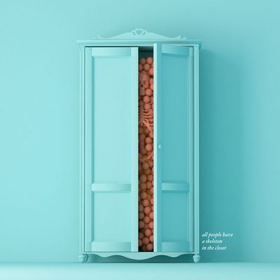 a blue cabinet with a bunch of balls in it