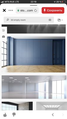 an empty room with blue walls and wooden floors