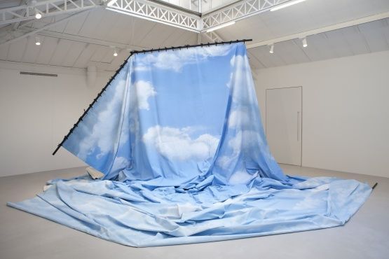 a large blue blanket is covering a room