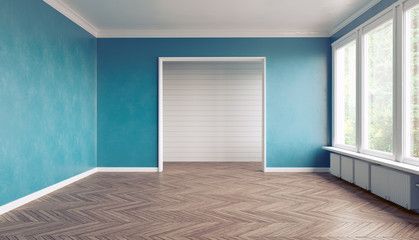 an empty room with blue walls and wood floors