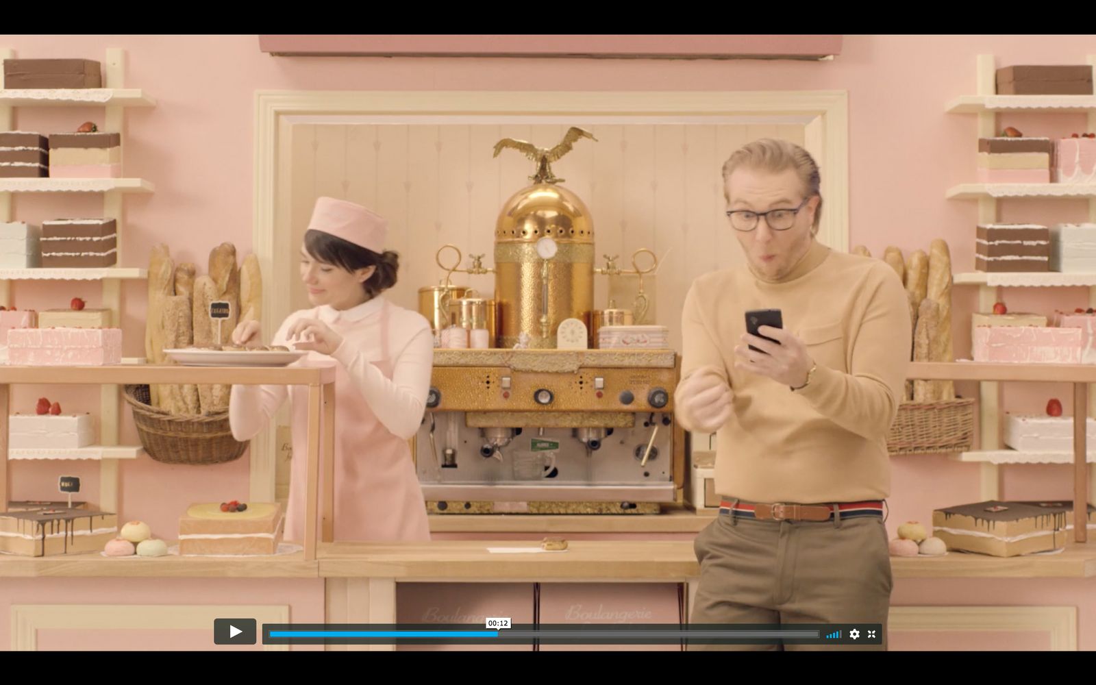 a man and a woman standing in front of a counter