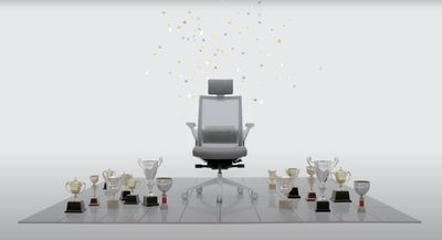 an office chair sitting on top of a table filled with wine glasses