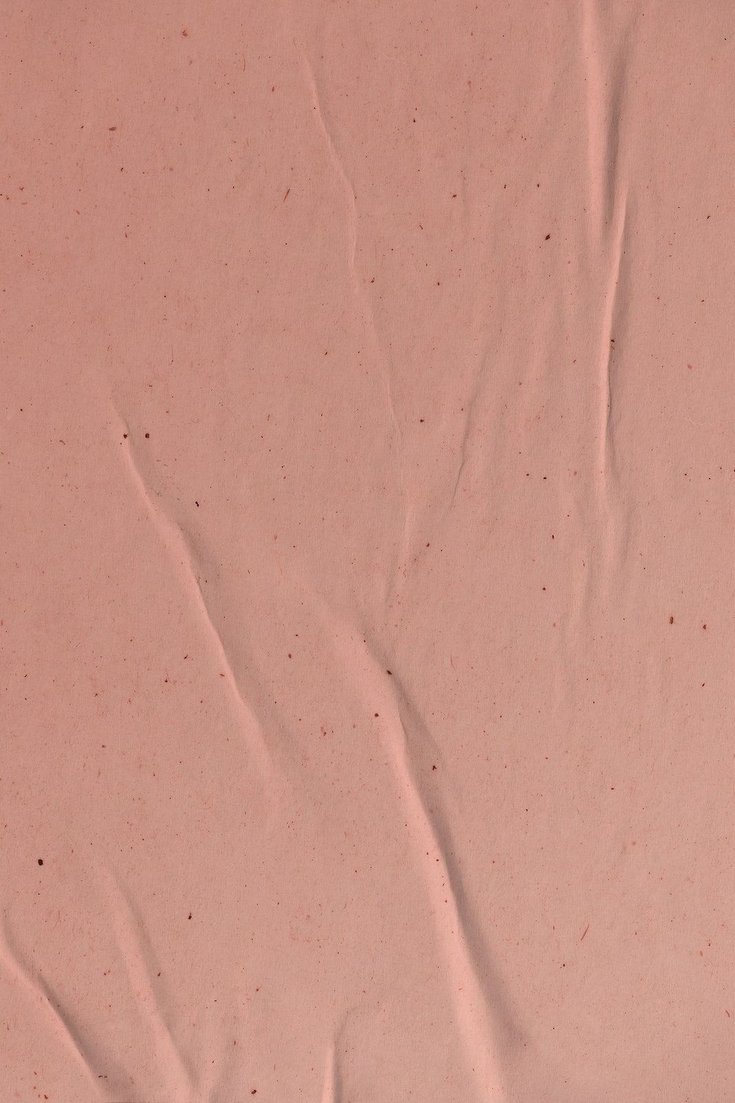 a close up of a piece of pink paper