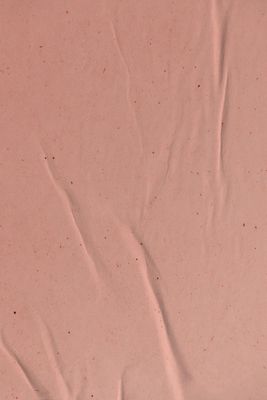 a close up of a piece of pink paper