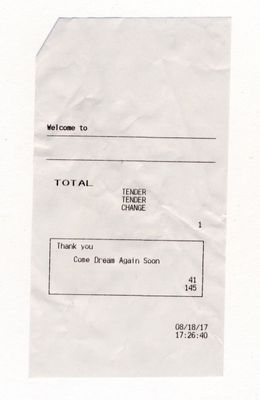 a piece of paper with a check card on it