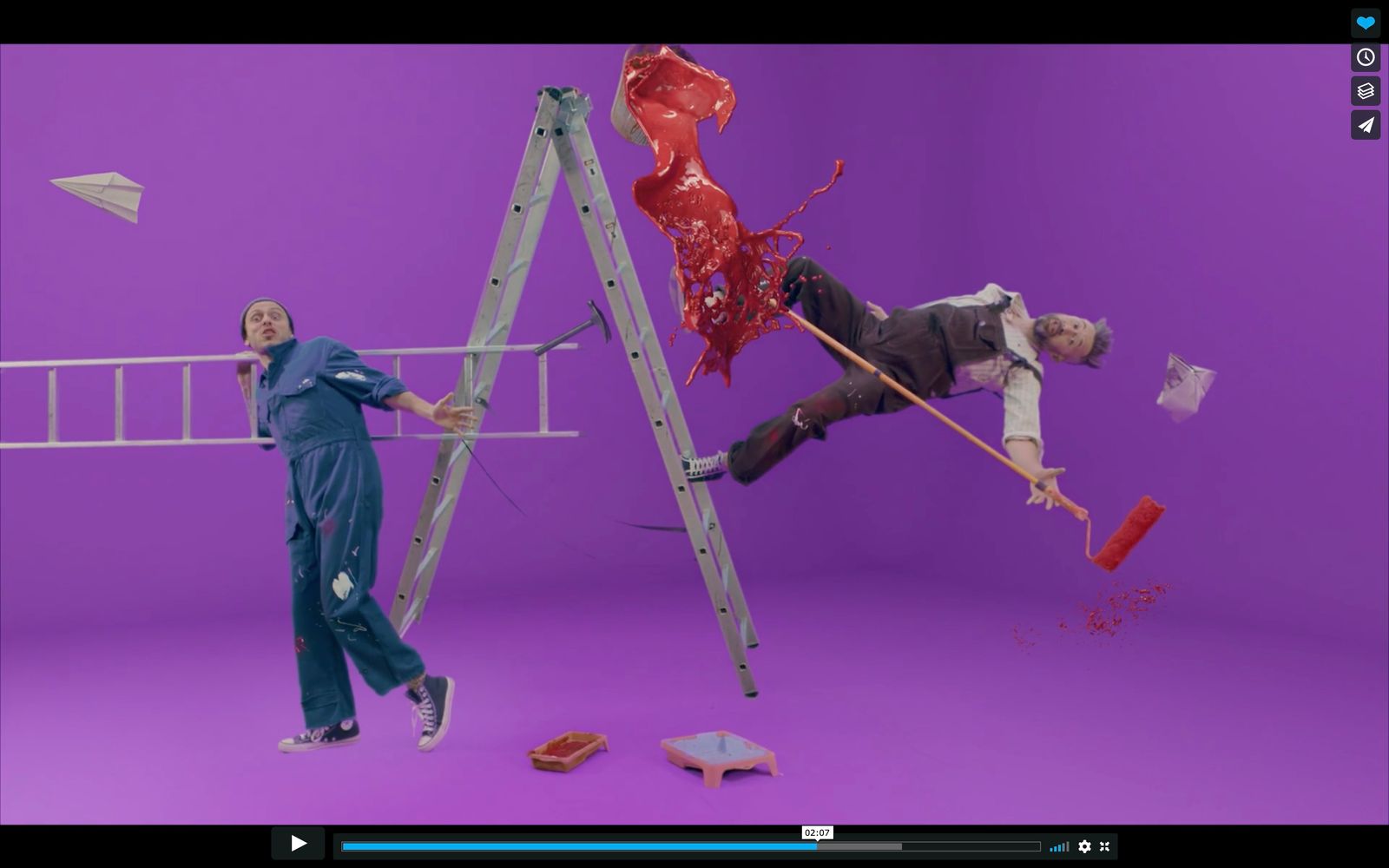 a man is climbing a ladder and another man is standing on a ladder