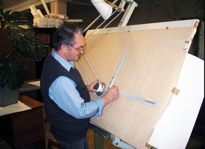 a man working on a piece of wood