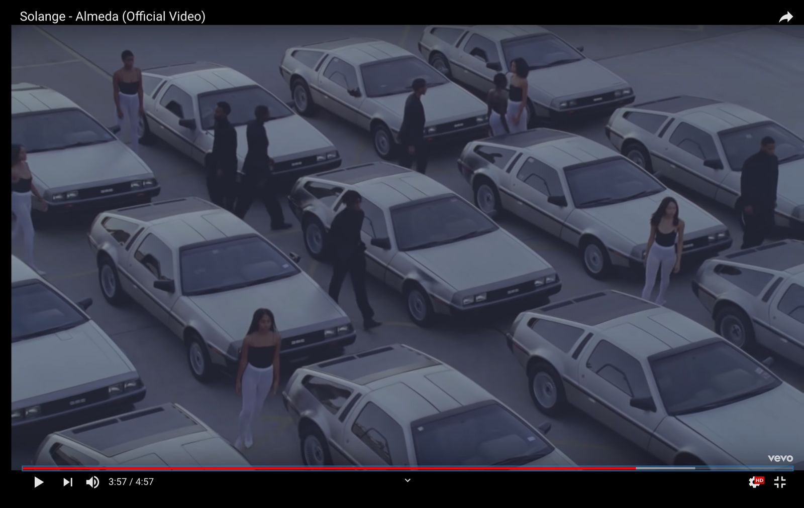 a large group of cars parked in a parking lot