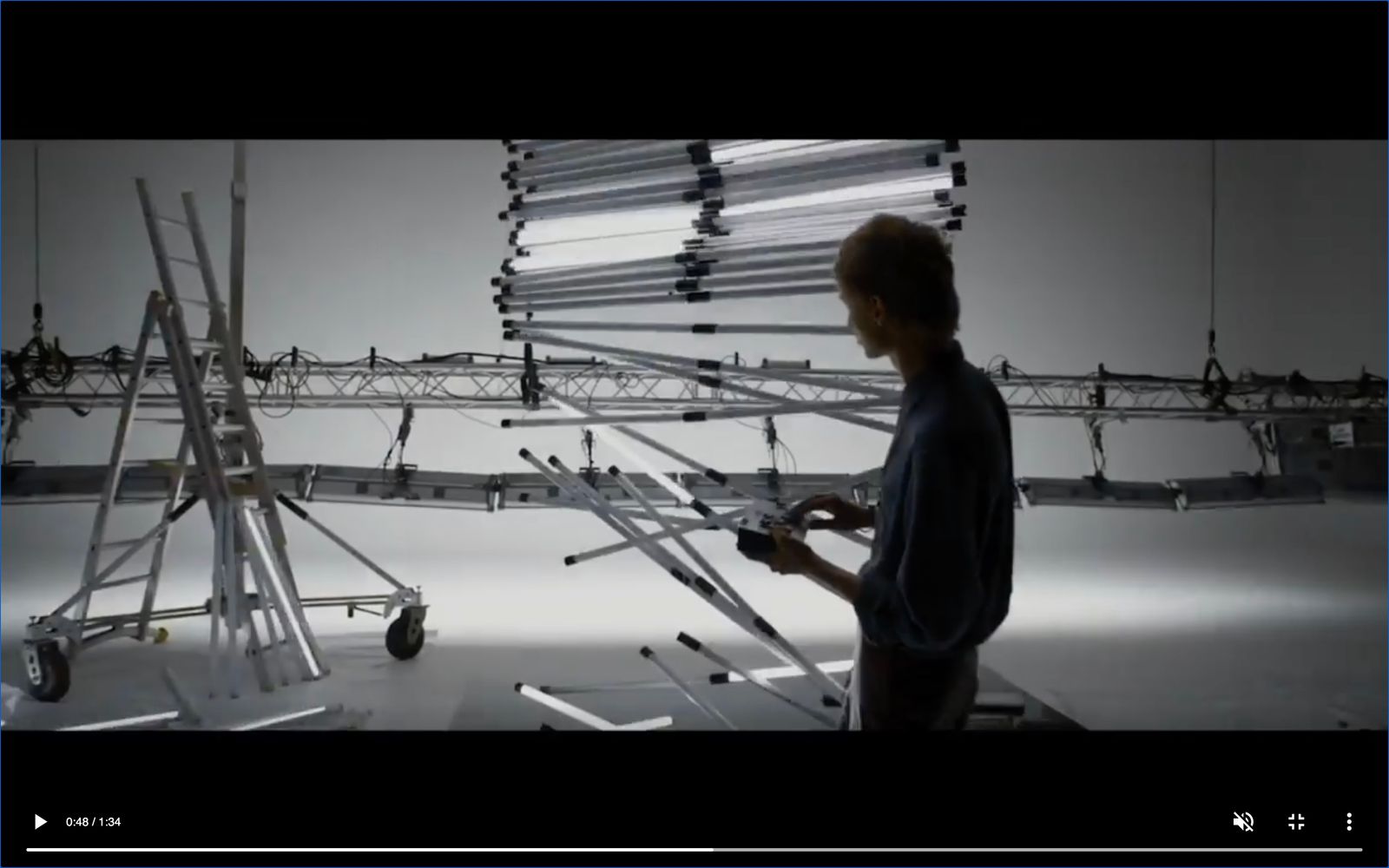 a man standing in front of a display of wires