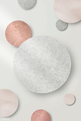 a white plate with pink and grey circles on it