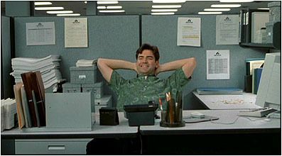 a man sitting at a desk in an office