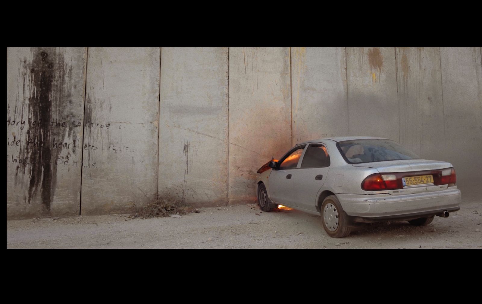 a car that is sitting in front of a wall