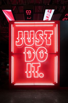 a neon sign that says just do it