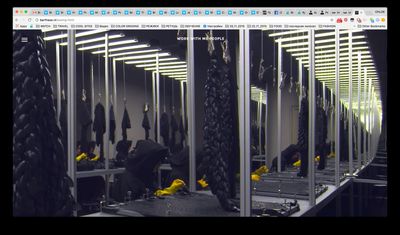 a room filled with lots of mirrors and lots of wires