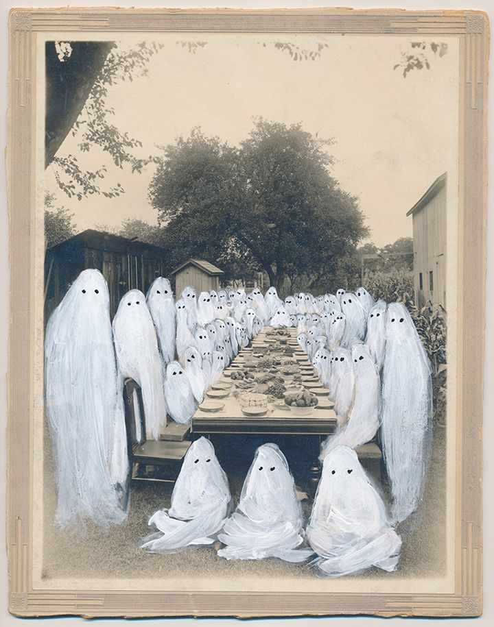 a group of ghost sitting at a long table