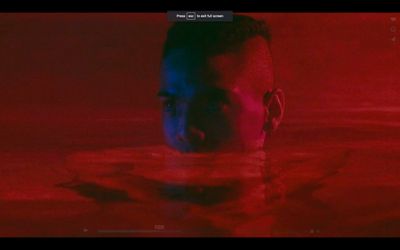 a man swimming in a pool of water