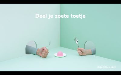 a couple of hands holding spoons over a plate