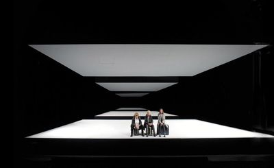 a group of people standing on top of a stage