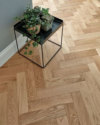 a small table with a plant on top of it