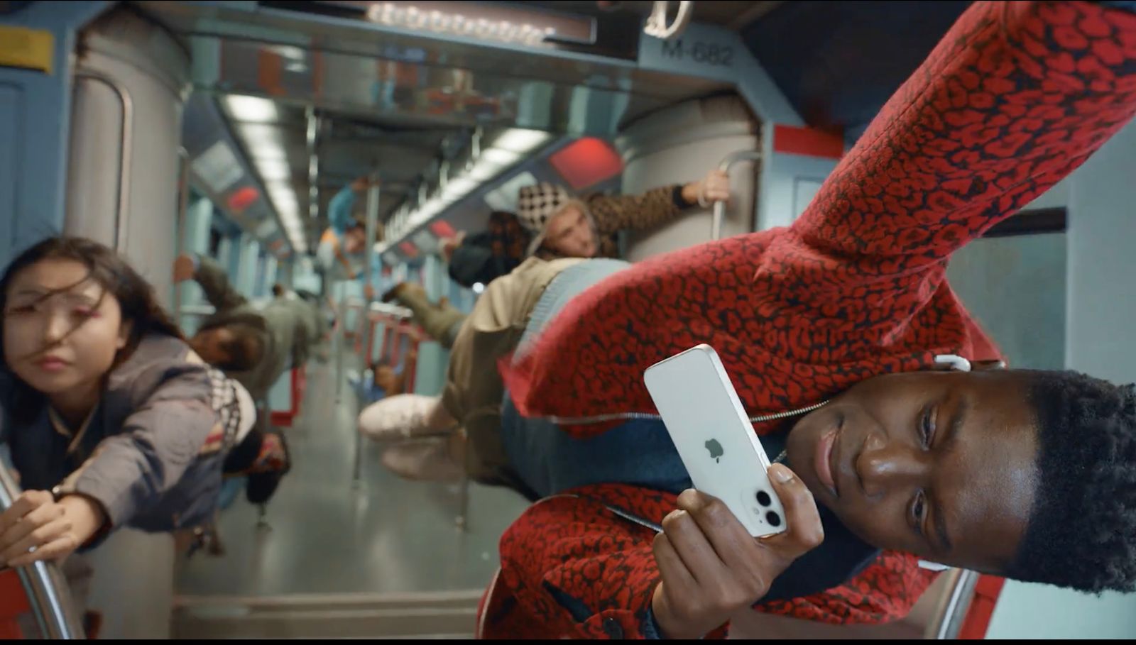 a woman on a train holding a cell phone