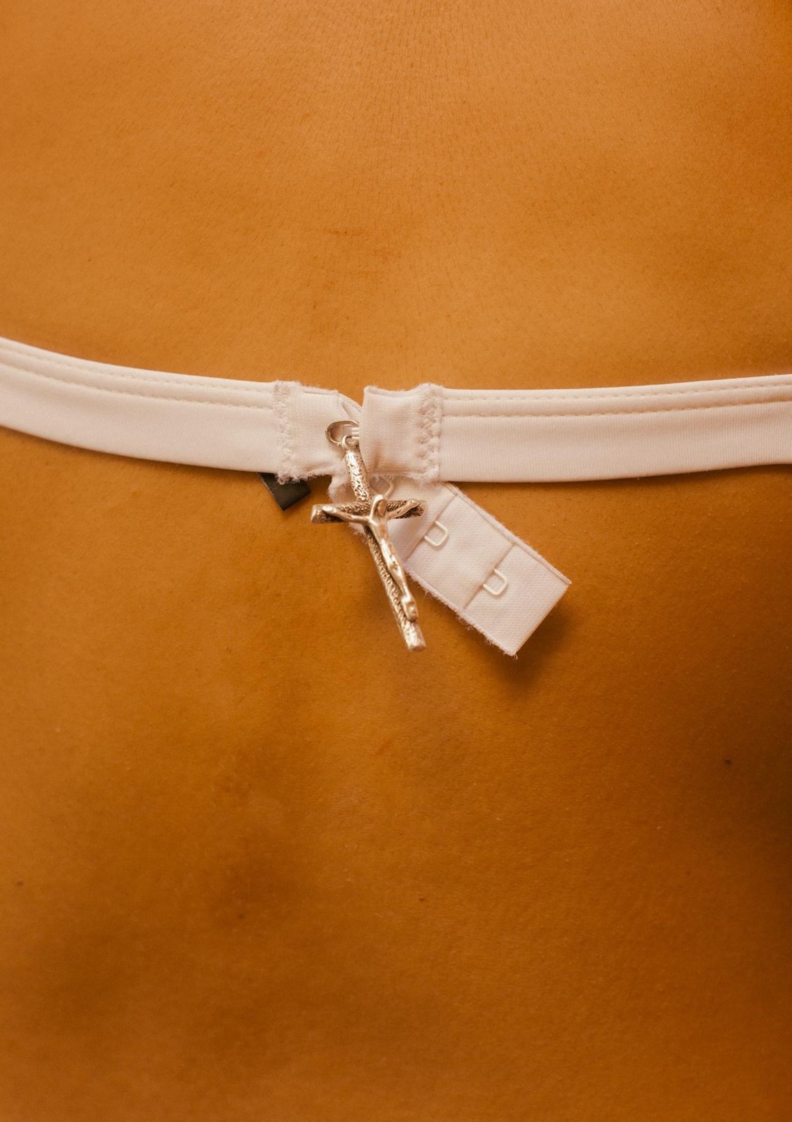 a close up of a person wearing a white belt