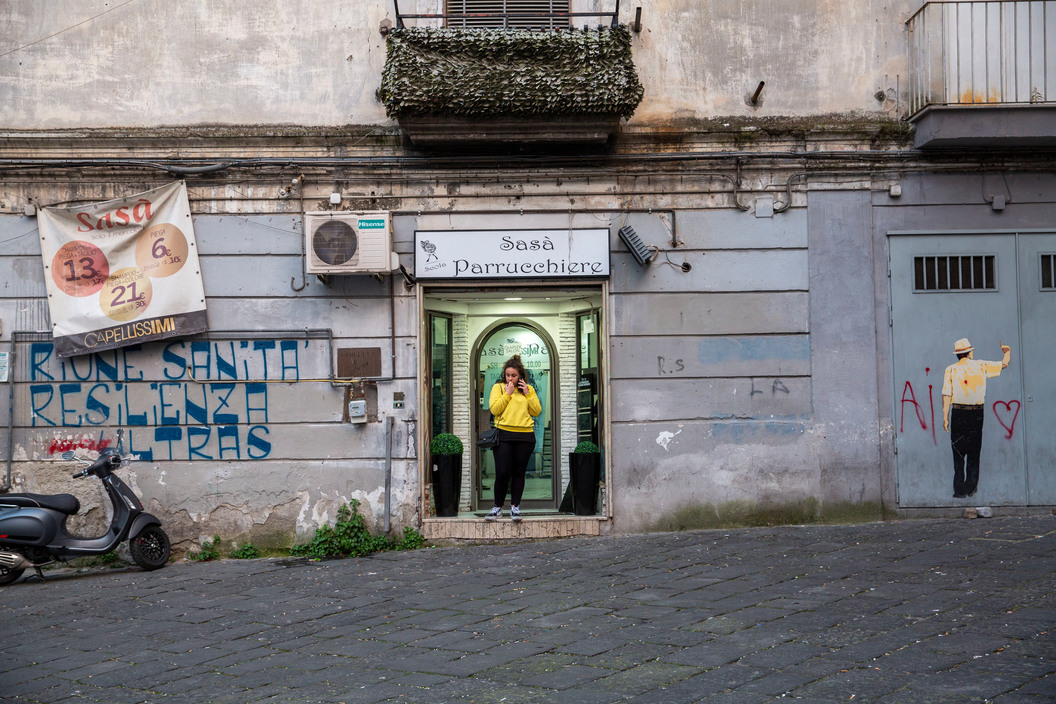 a woman standing in a doorway of a building