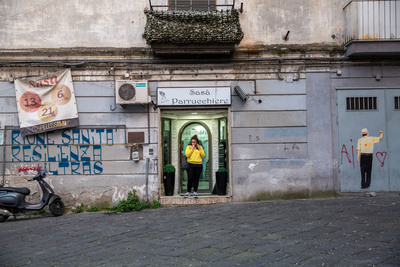 a woman standing in a doorway of a building